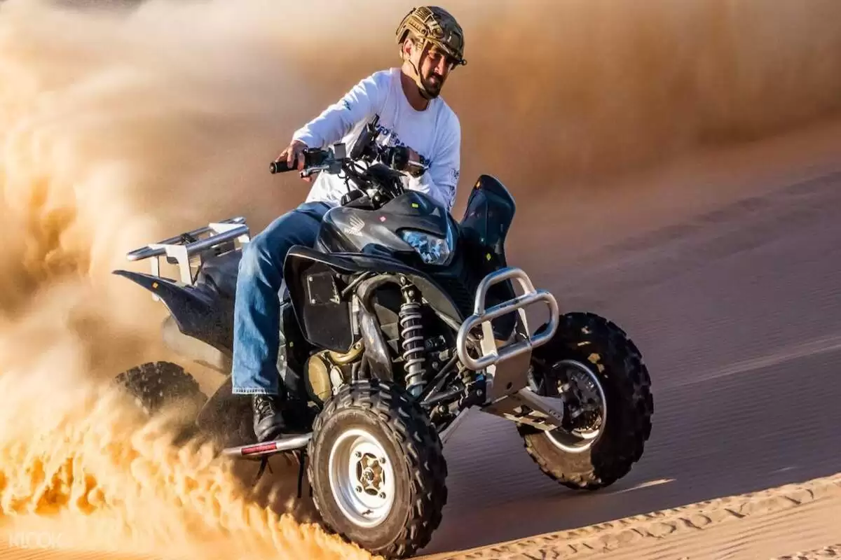 Sunset desert safari trip by ATV quad